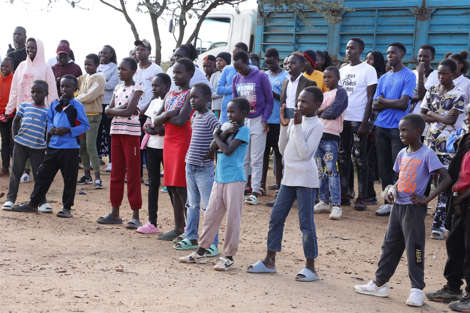 The wider Camp Hope community gathered outdoors